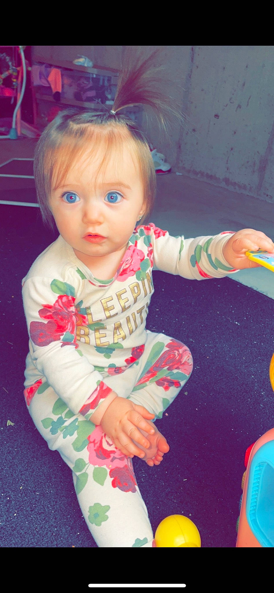 Aliyana is registered to the contest to win money with this photo: baby_toddler_clothing, cheek, child, cool, dress, eyelash, facial_expression, finger, fun, hair, hand, head, iris, organ, person, photograph, pink, skin, sleeve, standing