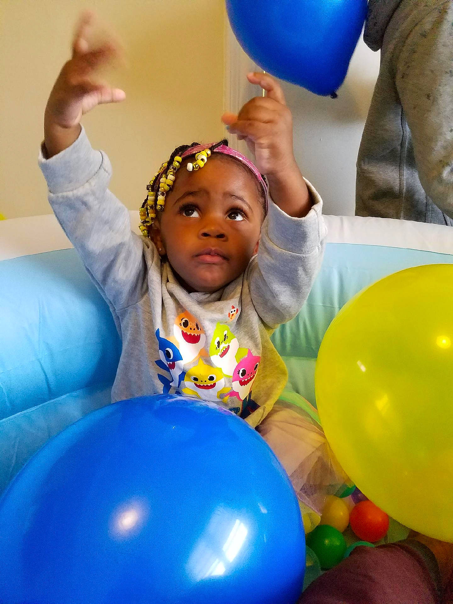 Avah is registered to the contest to win money with this photo: balloon, beauty, blue, child, electric_blue, event, fun, gesture, happy, leisure, party, party_supply, people, person, photograph, recreation, smile, snapshot, toddler, white