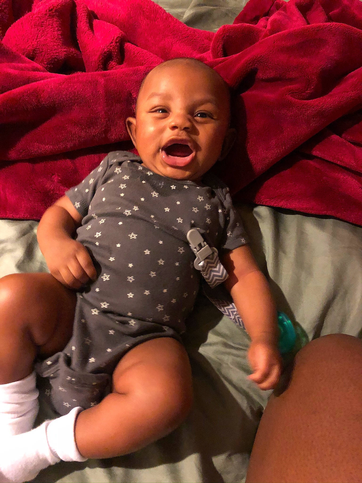 Lee is registered to the contest to win money with this photo: baby, child, facial_expression, finger, mouth, person, sitting, smile, toddler