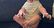 Wyatt joined the competition — help win amazing prizes! arm, baby, bib, blanket, child, clothing, couch, expression, foot, furniture, hand, happy, indoor, infant, light, person, playful, seat, smiling, texture