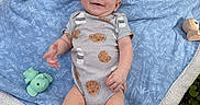 Wyatt joined the competition — help win amazing prizes! baby, infant, blanket, outdoor, grass, toys, elephant_toy, owl_toy, onesie, red_hair, smile, blue_eyes, happy, child, feet, hands, cat_tail, cat_paws, nature, relaxed