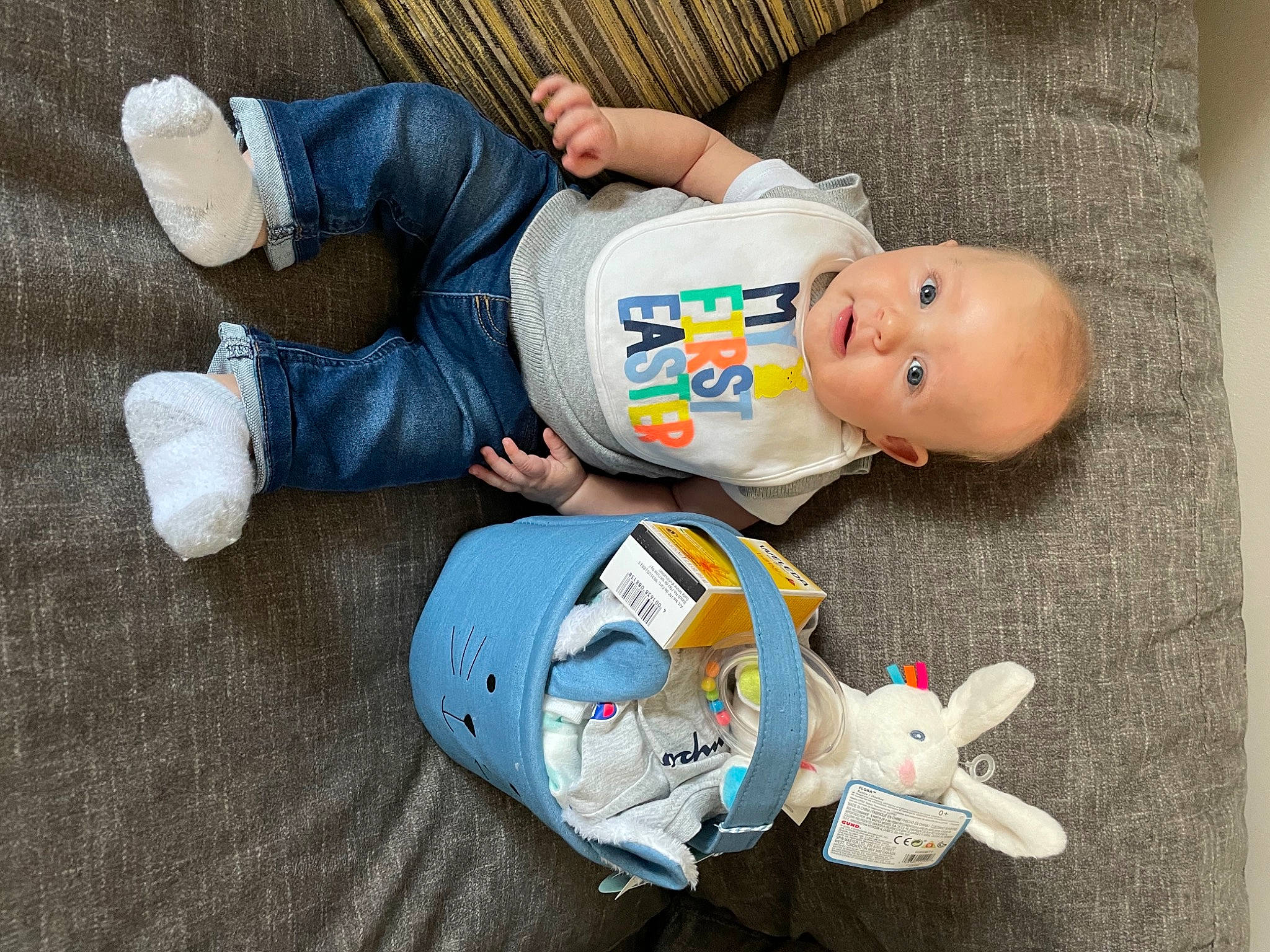 Bruce is registered to the contest to win money with this photo: arm, baby, baby_products, baby_sleeping, baby_toddler_clothing, baby_toys, child, comfort, fun, hand, linens, person, plastic, play, room, sitting, stuffed_toy, t_shirt, toddler, toy