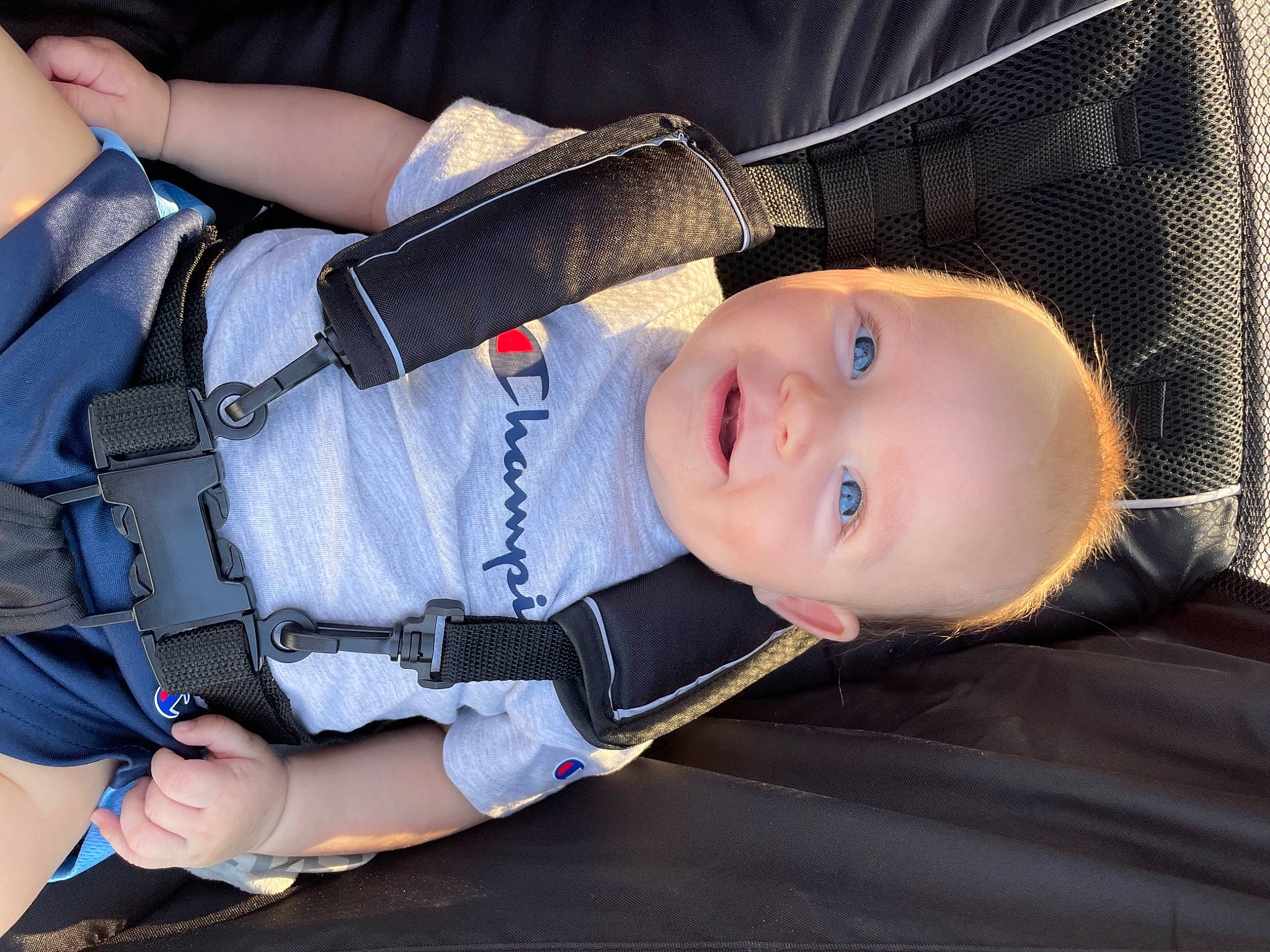 Bruce is registered to the contest to win money with this photo: baby, baby_products, baby_toddler_clothing, beauty, child, collar, comfort, cool, elbow, electric_blue, fun, hat, joy, pattern, person, product, sitting, sleeve, smile, strap