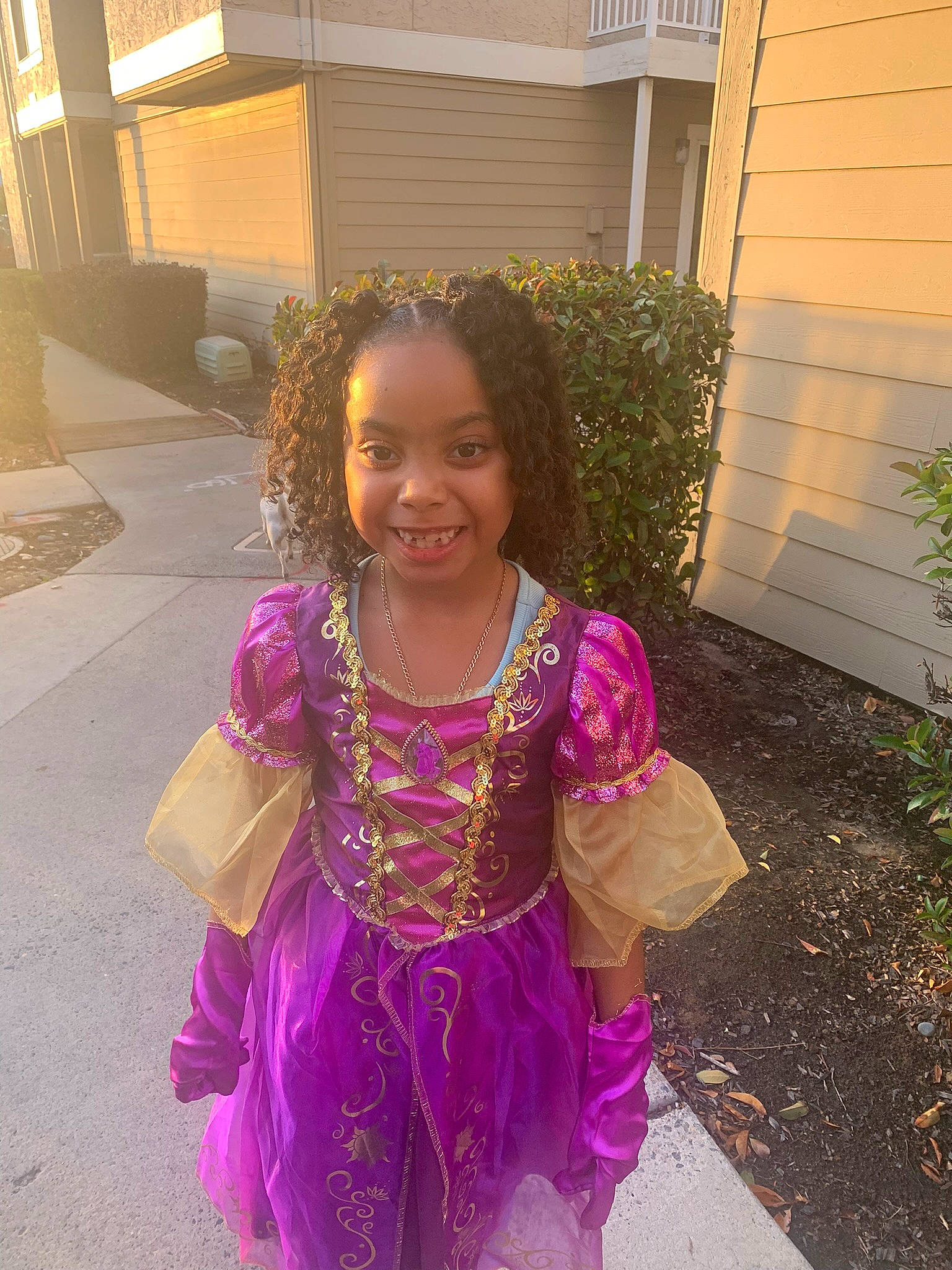 Clyrissa joined the competition — help win amazing prizes! baby_toddler_clothing, child, costume, dress, driveway, event, fun, grass, happy, head, joy, magenta, metal, person, pink, plant, purple, sitting, smile, toddler