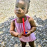 casual, child, cute, daylight, hairstyle, innocence, outdoor, person, pink_clothing, playground, portrait, sandals, standing, summer, sunlight, sunny_day, toddler, toy, wood_chips, young_child