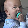 Rémy a rejoint le concours — aidez-le/la à gagner de superbes lots ! baby, child, dinosaur_pajamas, hand, indoors, mouth, object, pajamas, person, play, portrait, ring, sleeve, skin, teething, toy, young_child, face, cute, childhood