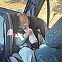 baby, car_seat, sleeping, pacifier, bottle, child, car_interior, seatbelt, sunlight, window, travel, infant, clothing, safety, seat, child_safety, rest, peaceful, transportation, young_child