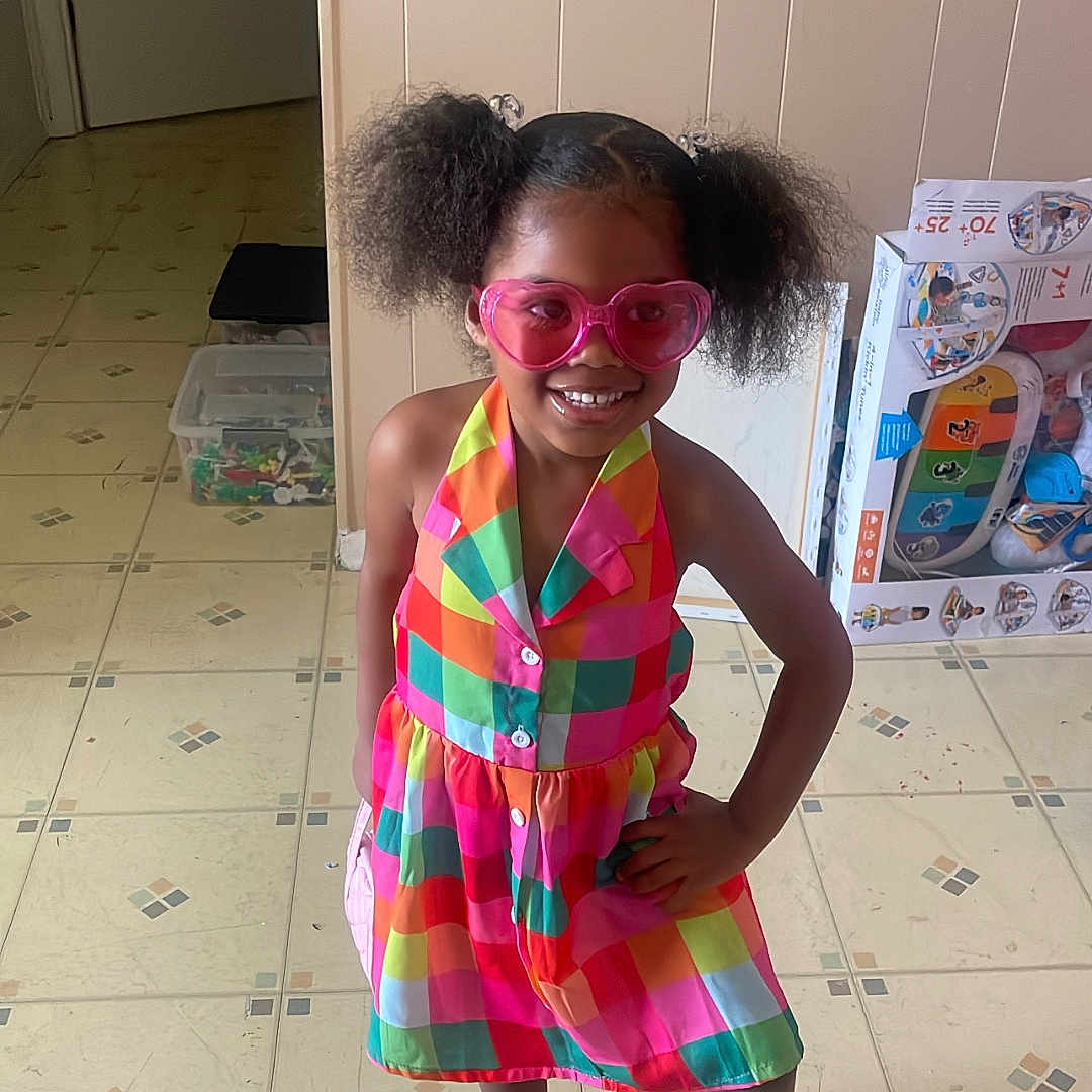 Kelanii is registered to the contest to win money with this photo: accessories, child, clothing, door, dress, face, fashion, female, footwear, formalwear, girl, glasses, head, person, photography, portrait, sandal, shoe, skirt, sunglasses