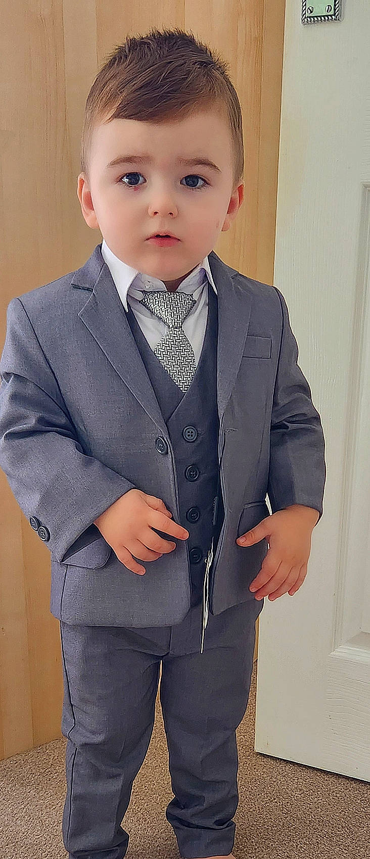 Sebastian is registered to the contest to win money with this photo: blazer, button, chin, clothing, collar, dress_shirt, electric_blue, face, formal_wear, gesture, hairstyle, neck, outerwear, person, school_uniform, shirt, sleeve, suit, tie, white