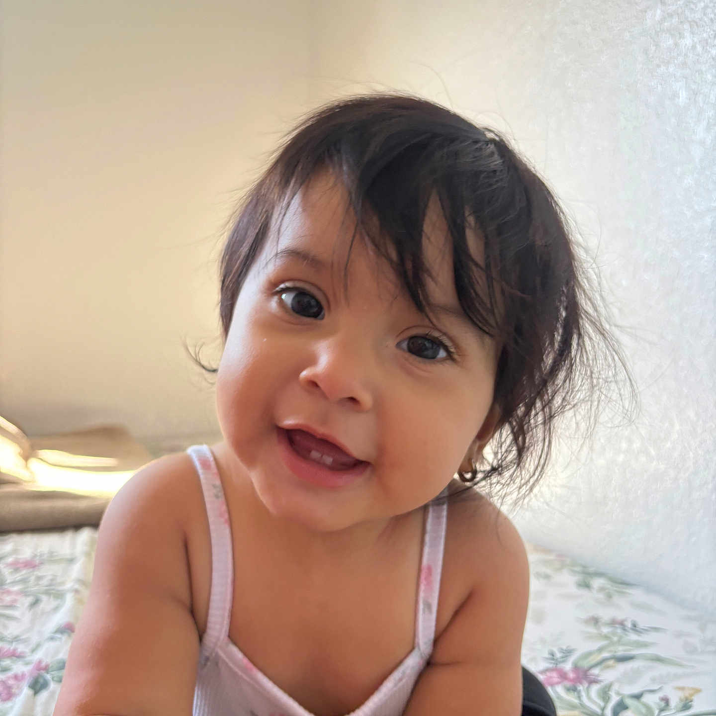 Marelyn joined the competition — help win amazing prizes! baby, bed, child, crawling, cute, expression, eyes, face, floral, hair, happy, indoor, infant, person, portrait, skin, smiling, tank_top, toddler, young_child