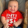 baby, baby_face, baby_hands, blue_shorts, casual, child, chubby_cheeks, clothing, cute, happy, indoor, infant, infant_clothing, person, portrait, red_shirt, seatbelt, sitting, smiling, stroller