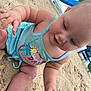 baby, child, sand, beach, tank_top, playing, happy, outdoor, summer, cute, skin, foot, hand, playground, daytime, infant, nature, smiling, person, sunny