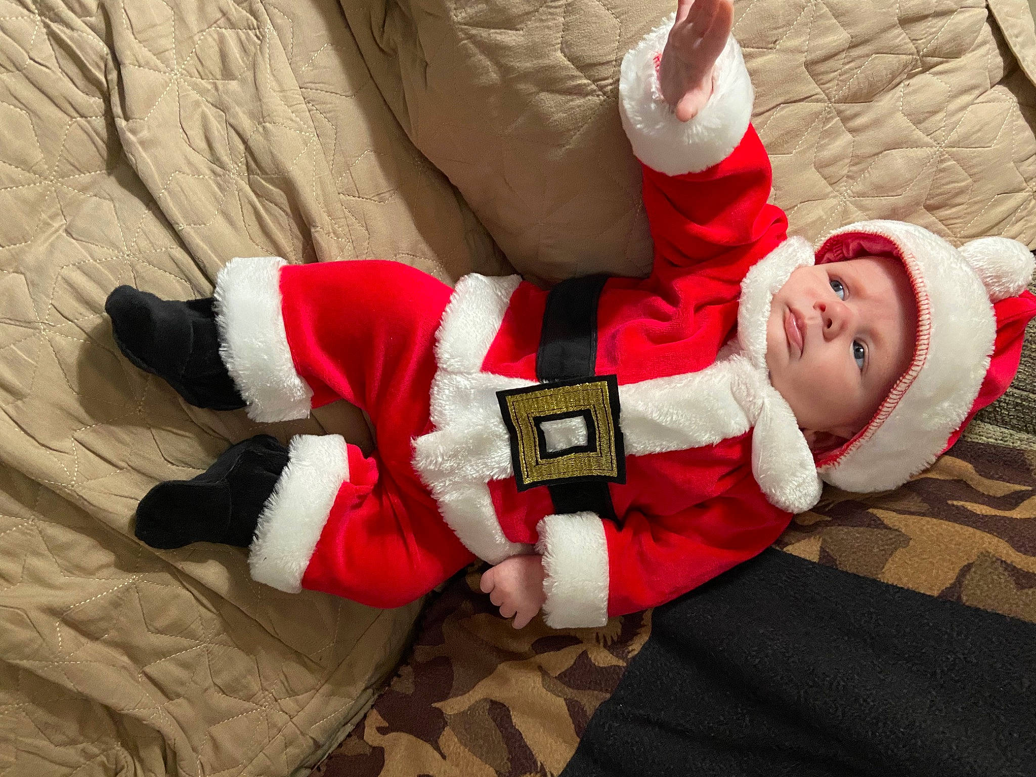 Bentley joined the competition — help win amazing prizes! baby, baby_toddler_clothing, carmine, comfort, event, fictional_character, happy, headwear, holiday, human_body, human_leg, knee, lap, person, red, santa_claus, sitting, sleeve, smile, sock
