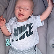 Teddie joined the competition — help win amazing prizes! baby, infant, smiling, sleeping, nike, clothing, shorts, tshirt, pacifier, cushion, carrier, comfort, relaxation, child, person, happy, cute, portrait, indoors, young