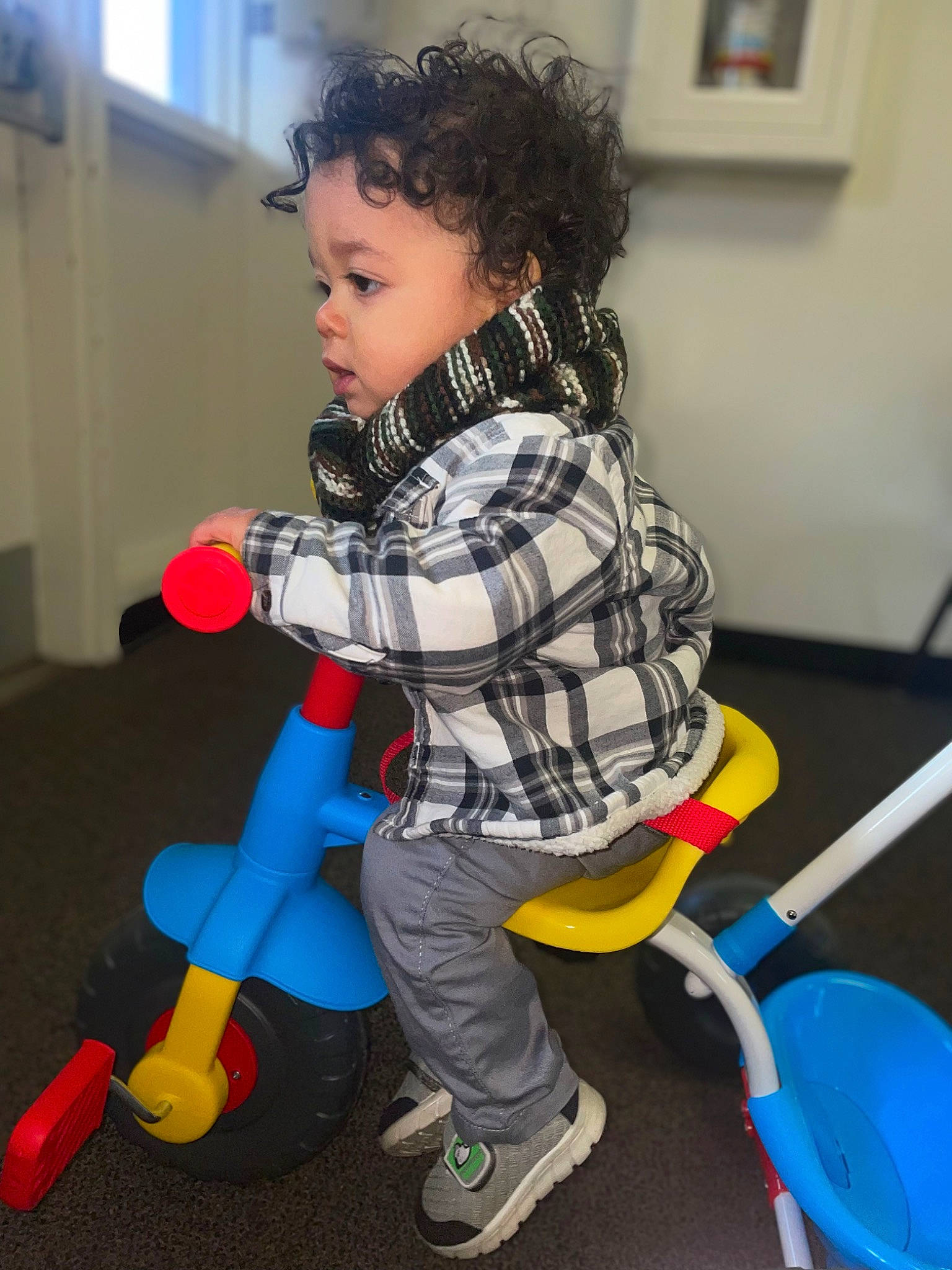 Derek is registered to the contest to win money with this photo: baby_playing_with_toys, baby_toddler_clothing, baby_toys, child, electric_blue, fictional_character, flooring, fun, pattern, people, person, play, riding_toy, sneakers, sock, standing, tire, toddler, toy, toy_vehicle