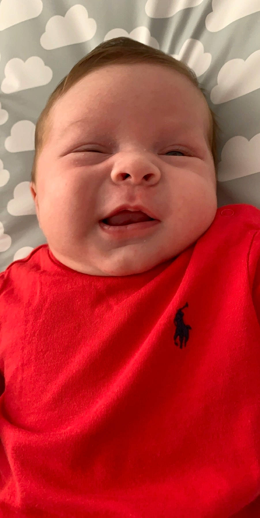 Reggie is registered to the contest to win money with this photo: baby, baby_making_funny_faces, bedtime, cheek, child, chin, face, facial_expression, forehead, head, laugh, lip, mouth, nose, person, red, skin, smile, toddler