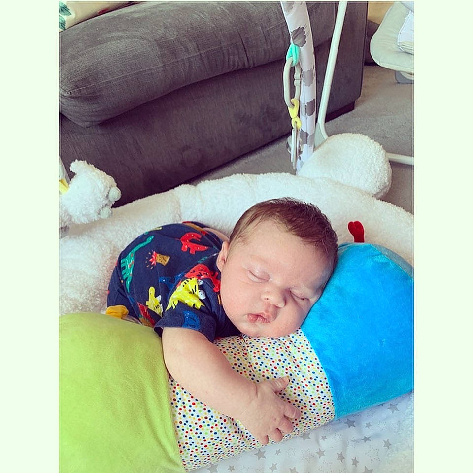Reggie joined the competition — help win amazing prizes! baby, baby_sleeping, bedtime, child, comfort, furniture, happy, love, nap, person, pillow, play, product, room, sleep, snapshot, square, textile, toddler, turquoise