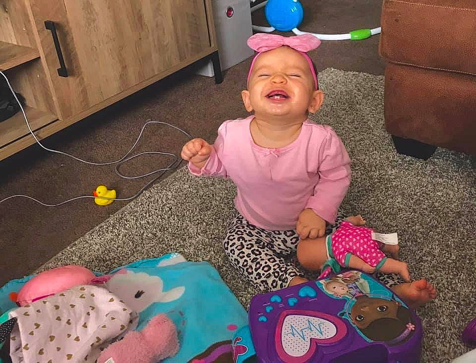 Isabella is registered to the contest to win money with this photo: birthday, child, face, happy, head, party, person, play, sitting, toddler, toy