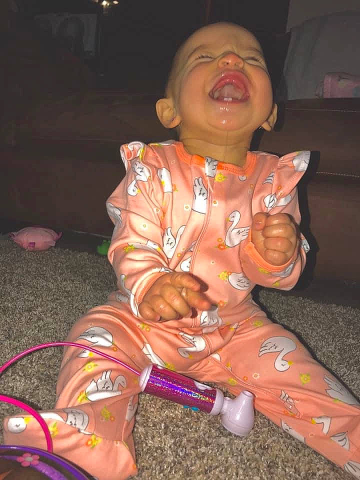 Isabella is registered to the contest to win money with this photo: child, fun, person, sitting, vacation