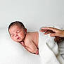 Noham a rejoint le concours — aidez-le/la à gagner de superbes lots ! newborn, baby, sleeping, blanket, hands, white_background, soft_texture, peaceful, infant, portrait, tenderness, skin, closeup, rest, care, human, child, lying_down, family, comfort