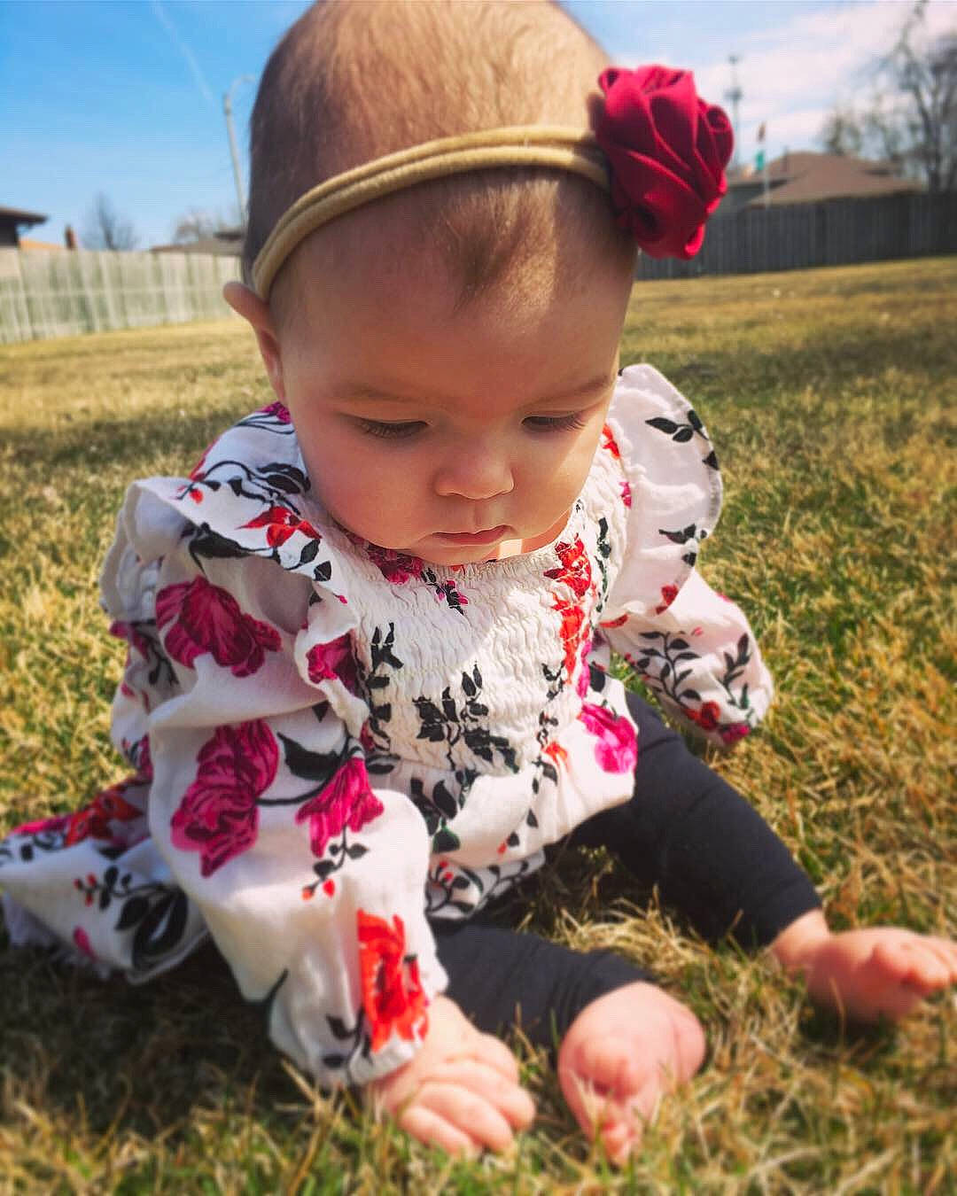 Emiliana is registered to the contest to win money with this photo: baby, child, grass, grass_family, happy, headgear, meadow, person, plant, play, skin, smile, spring, toddler