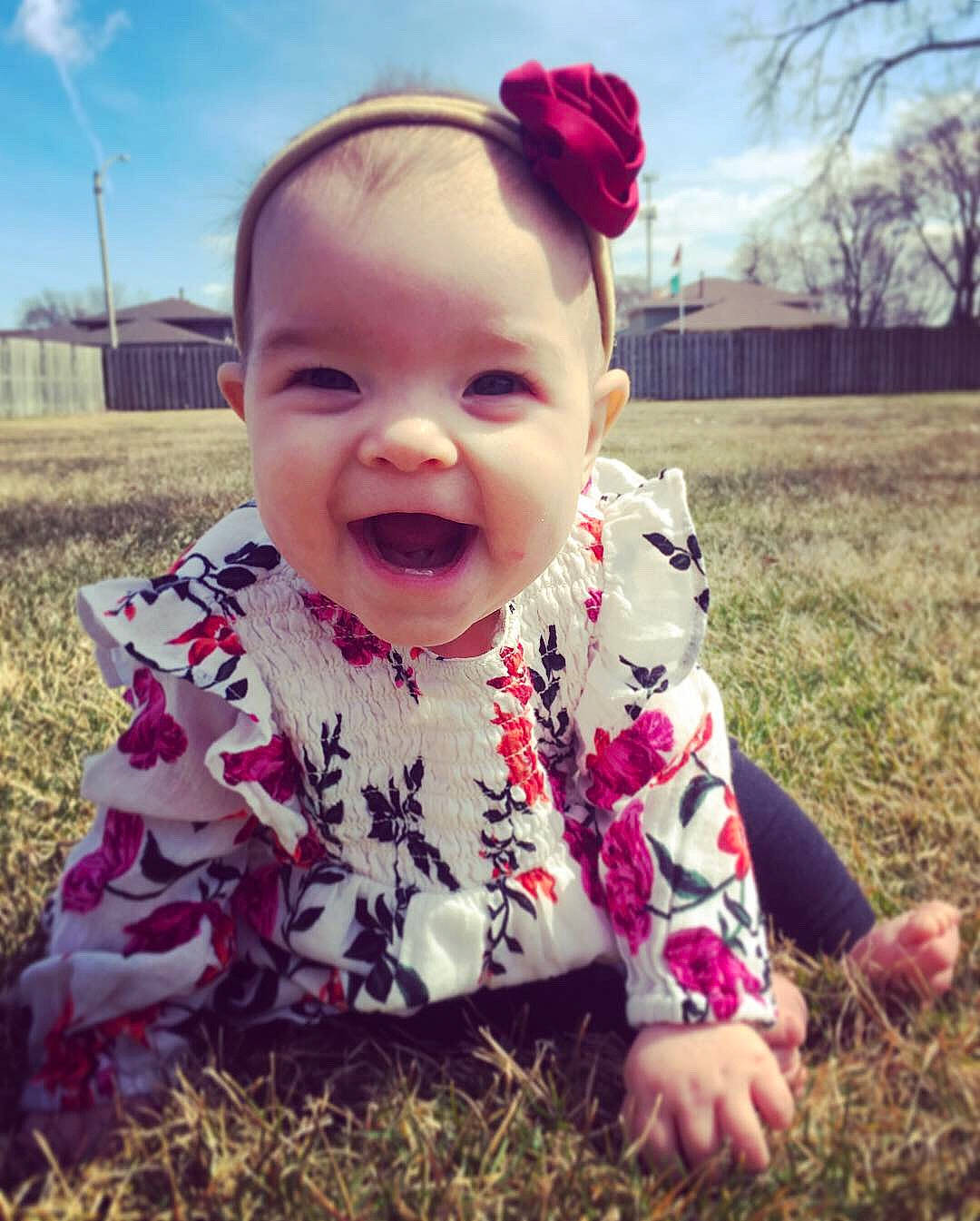 Emiliana joined the competition — help win amazing prizes! baby, cheek, child, cool, eye, face, facial_expression, forehead, grass, grass_family, head, leaf, lip, mouth, nose, person, pink, skin, sky, smile