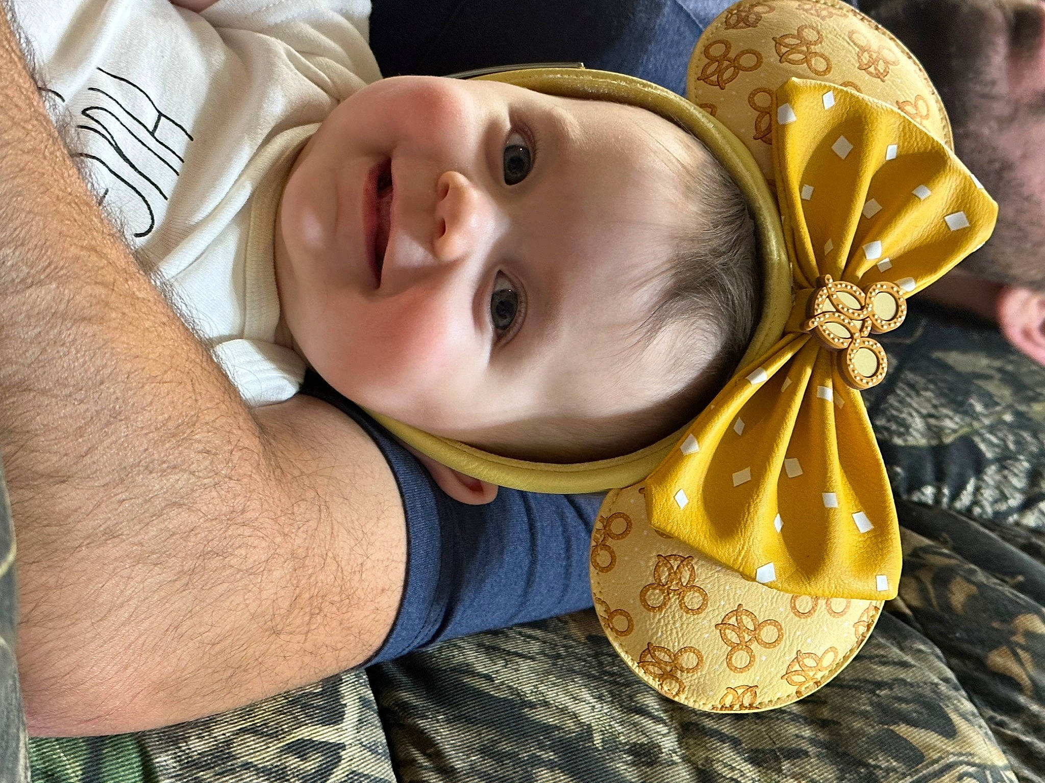 Alice is registered to the contest to win money with this photo: baby, baby_toddler_clothing, cheek, child, costume_hat, eye, fashion_accessory, fun, grass, happy, hat, headgear, joy, people_in_nature, person, portrait_photography, smile, sun_hat, toddler, wood