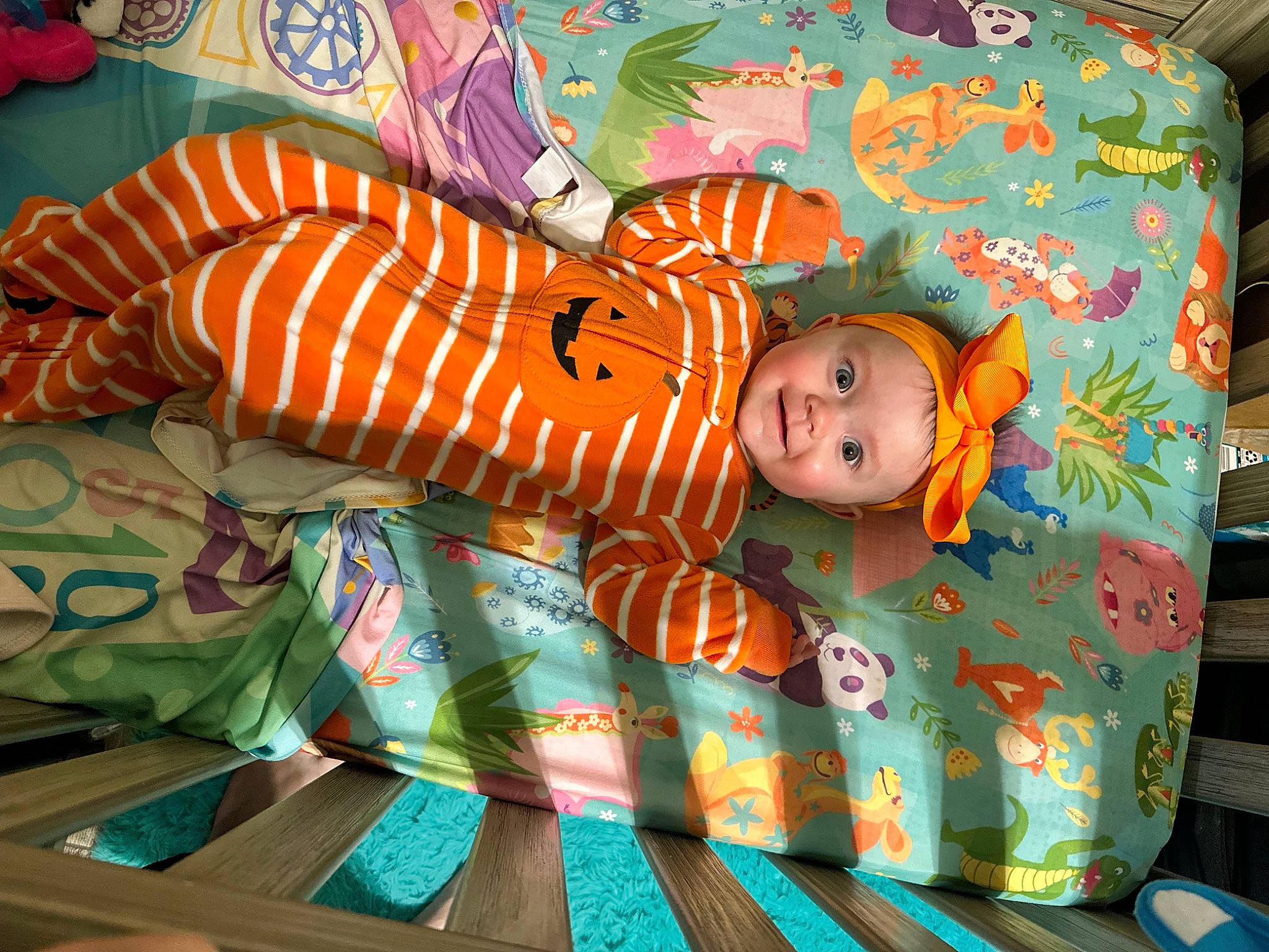 Alice is registered to the contest to win money with this photo: art, baby, baby_products, baby_toddler_clothing, baby_toys, bed_sheet, bedding, bedtime, child, comfort, hat, headwear, joy, linens, orange, pattern, person, play, quilt, room