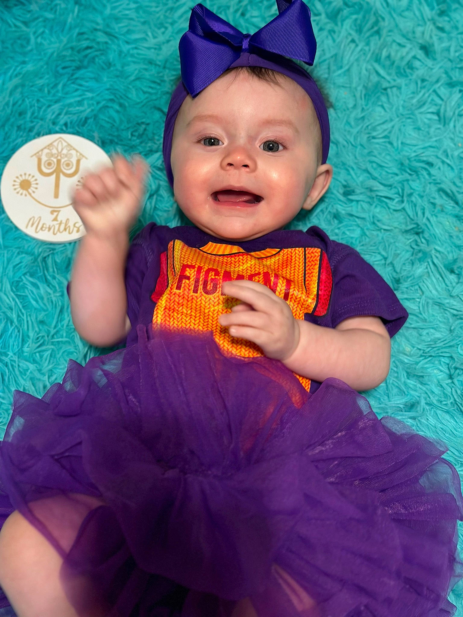 Alice is registered to the contest to win money with this photo: aqua, baby_toddler_clothing, beauty, blue, child, costume_hat, electric_blue, fun, happy, hat, head, human_body, magenta, person, pink, purple, skin, sleeve, smile, toddler