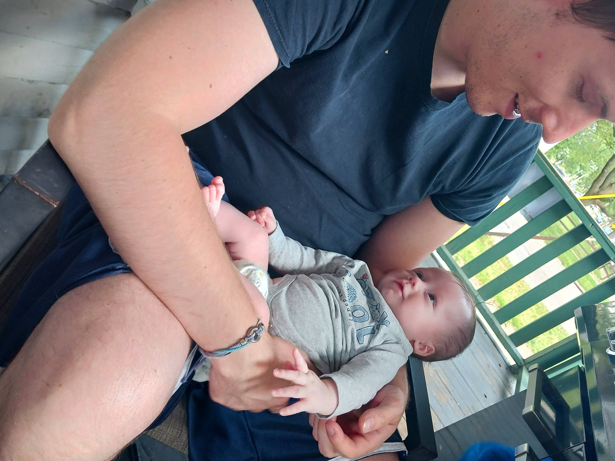 Damian is registered to the contest to win money with this photo: baby, chair, child, comfort, elbow, fun, gesture, grass, happy, human_leg, joy, lap, leg, muscle, people, person, shorts, sitting, summer, thigh