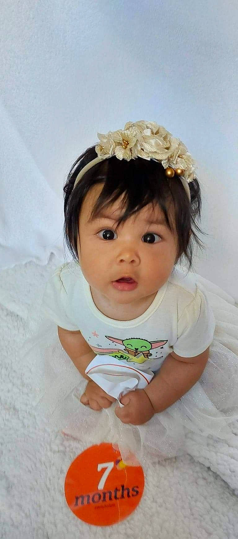 Emilia joined the competition — help win amazing prizes! baby, baby_toddler_clothing, bridal_accessory, cheek, child, embellishment, eyelash, fashion_accessory, hair, hair_accessory, happy, headband, headgear, headpiece, iris, jewellery, lip, person, skin, sleeve