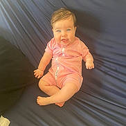 Isla joined the competition — help win amazing prizes! baby, blue_eyes, pink_onesie, smiling, wet_hair, couch, infant, happy, sitting, child, young, indoor, clothing, face, person, cute, skin, furniture, portrait, young_child