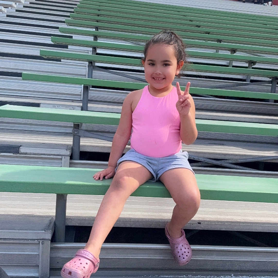 Emma joined the competition — help win amazing prizes! accessories, bag, bodypart, child, clothing, face, female, finger, footwear, girl, hand, handbag, head, person, photography, portrait, sandal, shoe, shorts, sitting