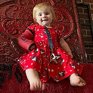 Isabelle is registered to the contest to win money with this photo: baby, brick_wall, carpet, cast, child, cute, decorative_panel, happy, home_interior, indoor, mickey_mouse, pacifier, playful, portrait, red_cushion, red_dress, sitting, smile, toddler, young_child