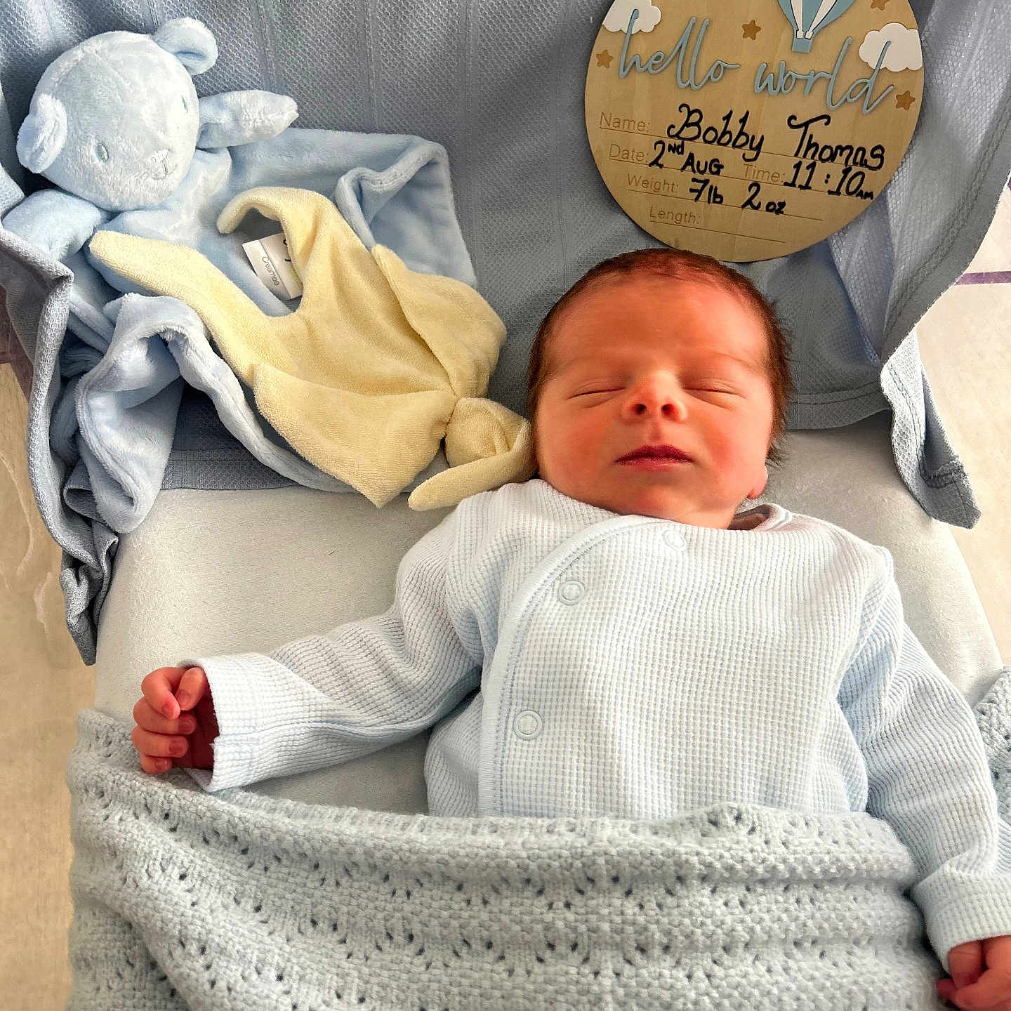 Bobby is registered to the contest to win money with this photo: announcement, baby, bed, blanket, blue, clothing, cute, face, hand, indoors, infant, newborn, peaceful, plush_toy, resting, sign, sleeping, soft, toddler, wrapped