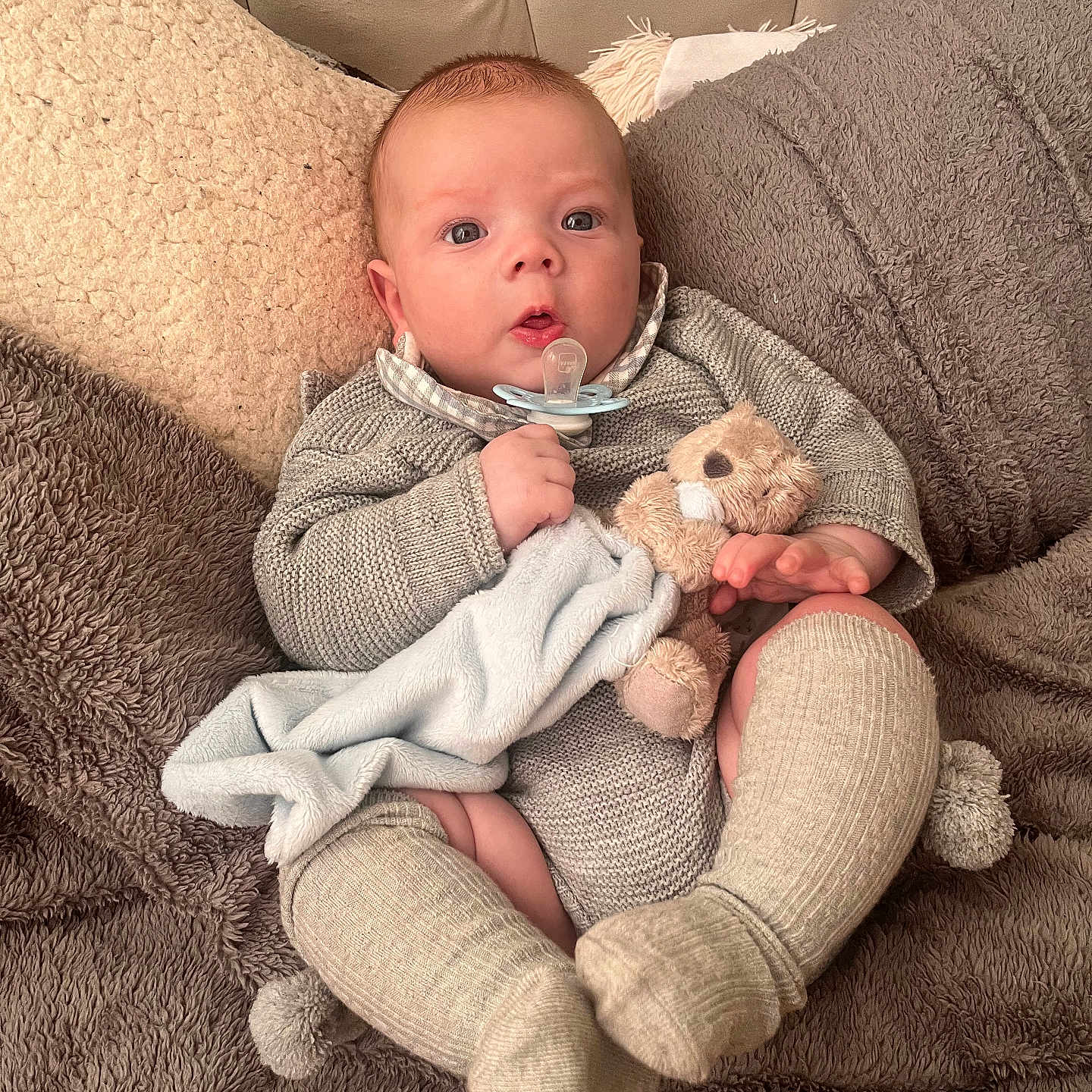 Elijah is registered to the contest to win money with this photo: baby, bed, blanket, clothing, couch, cushion, face, furniture, head, homedecor, hosiery, newborn, person, photography, portrait, quilt, sitting, sleeping, sock, toy
