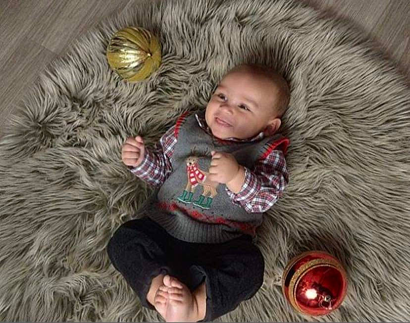 Javion joined the competition — help win amazing prizes! baby, child, christmas, christmas_ornament, comfort, event, grass, happy, iris, nose, people, people_in_nature, person, plant, skin, smile, textile, toddler, toy, tree