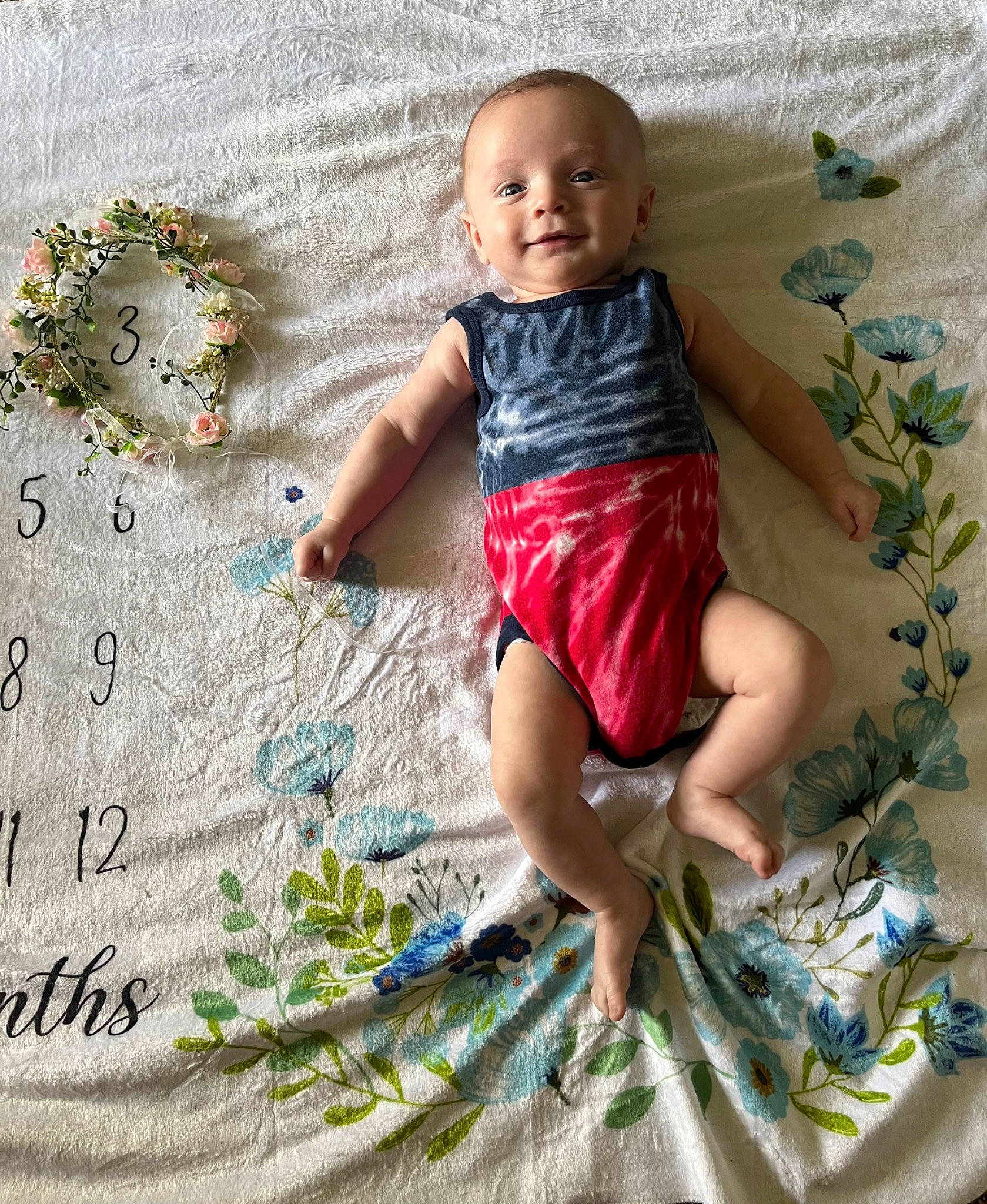 Jace is registered to the contest to win money with this photo: adaptation, baby_toddler_clothing, child, fun, happy, head, human_leg, leg, leisure, linens, pattern, people_in_nature, person, shorts, sitting, smile, t_shirt, textile, thigh, toddler