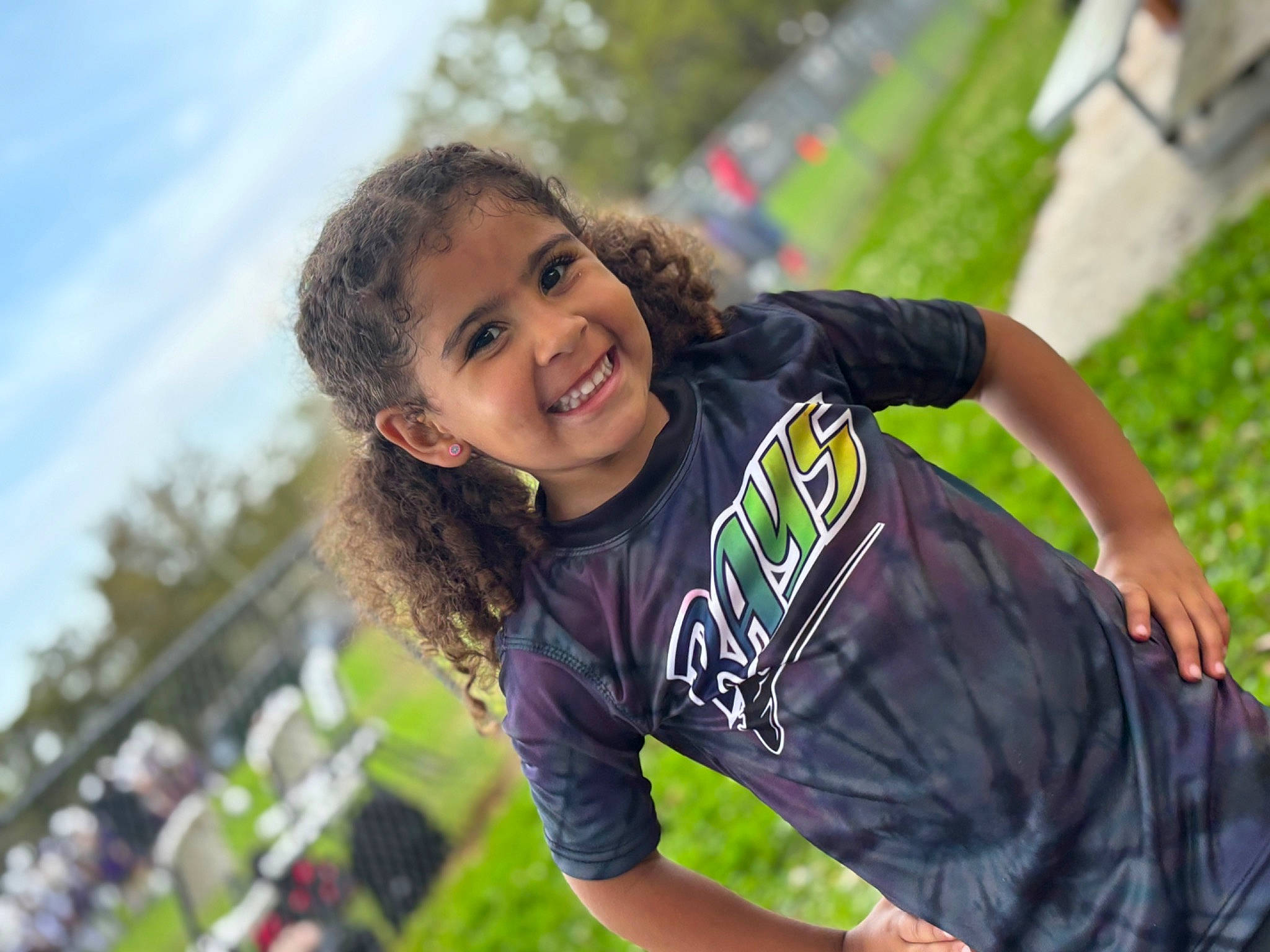Leilani joined the competition — help win amazing prizes! child, flash_photography, fun, grass, happy, joy, laugh, leisure, people_in_nature, person, plant, play, recreation, sitting, sky, smile, soil, summer, t_shirt, toddler