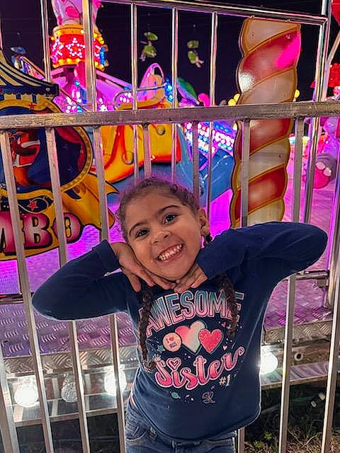 Leilani joined the competition — help win amazing prizes! beauty, child, clothing, event, fashion, fun, happy, human_settlement, joy, leisure, magenta, organ, person, pink, public_space, purple, recreation, sleeve, smile, snapshot