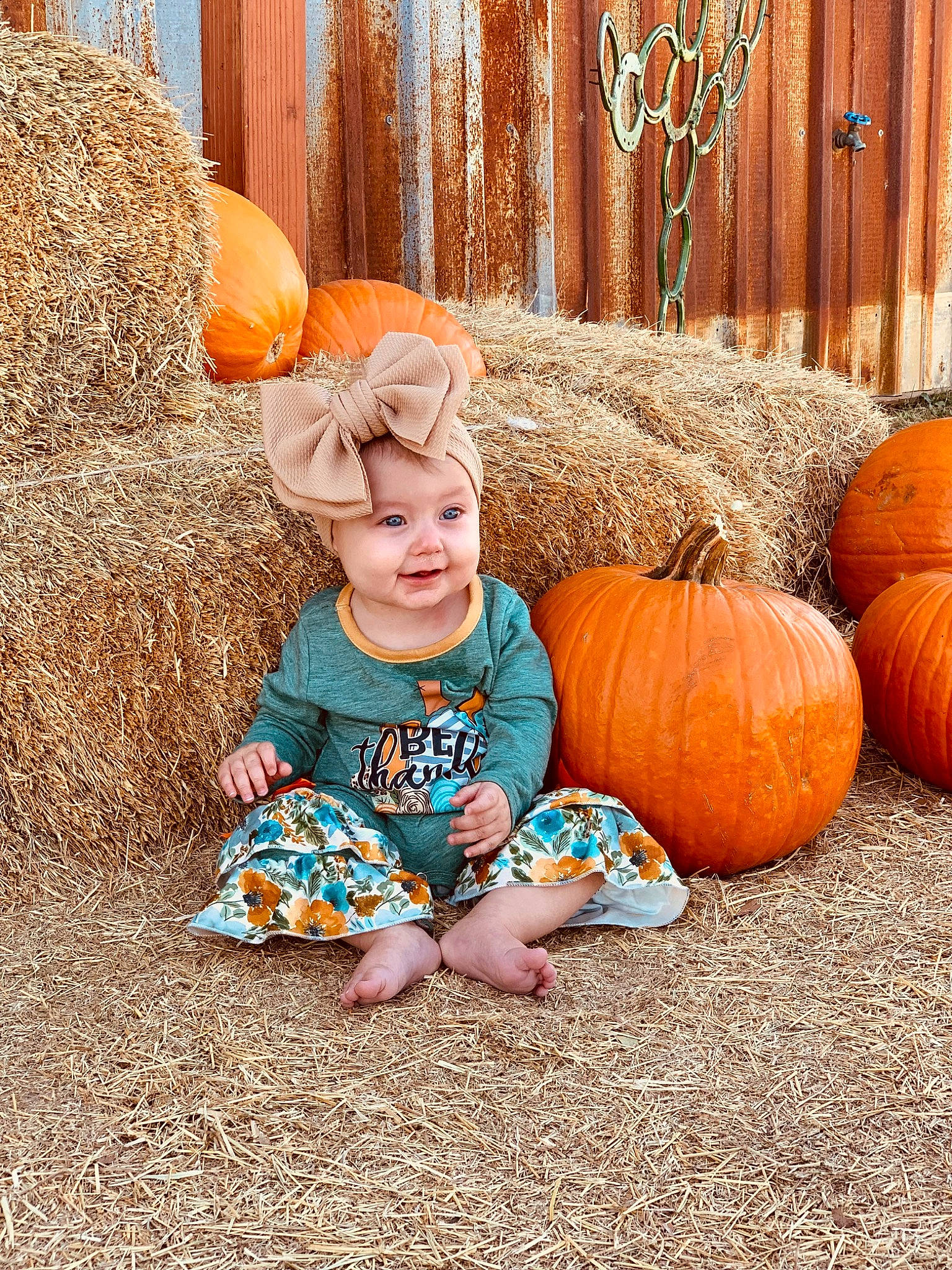 Kaislynn joined the competition — help win amazing prizes! baby_toddler_clothing, calabaza, cucurbita, facial_expression, gourd, grass, happy, headwear, leaf, natural_foods, nature, orange, people_in_nature, person, plant, pumpkin, sitting, squash, toddler, vegetable