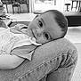 Milo participe au concours pour gagner de l'argent avec cette photo : baby, child, face, person, indoor, jeans, knee, striped_shirt, blanket, floor, window, furniture, piano, chair, table, cushion, black_and_white, portrait, relaxed, smile