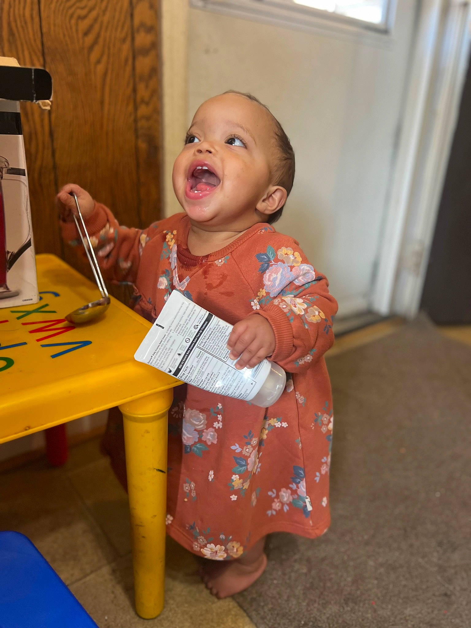 Journee joined the competition — help win amazing prizes! baby, chair, child, curtain, desk, finger, flooring, fun, happy, office_supplies, person, play, room, sitting, smile, table, toddler, wood