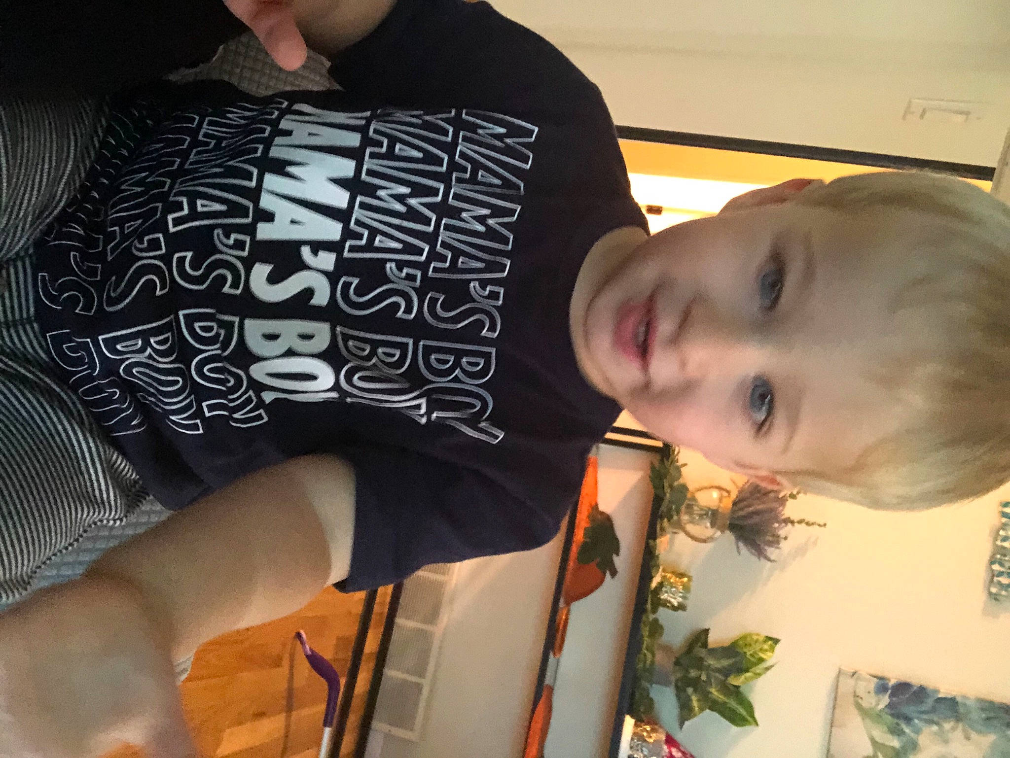 Luke is registered to the contest to win money with this photo: black, cheek, child, cool, elbow, eyewear, hairstyle, happy, human_body, human_leg, pattern, person, plant, sleeve, smile, t_shirt, thigh, toddler, top, white