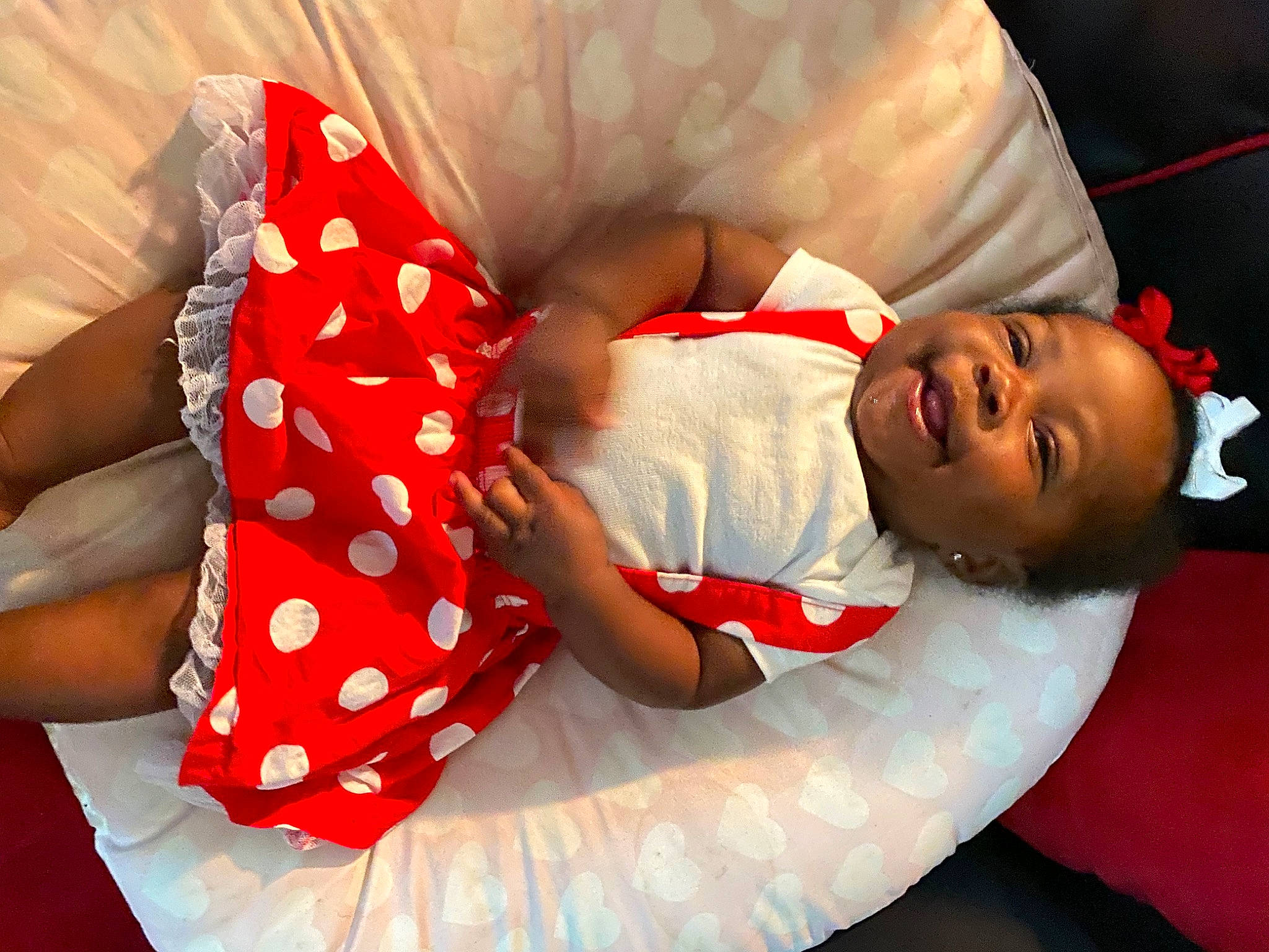 Auriyana is registered to the contest to win money with this photo: arm, baby, baby_sleeping, baby_toddler_clothing, child, comfort, dress, elbow, finger, hand, happy, headgear, human_body, human_leg, pattern, person, product, sleeve, smile, thigh