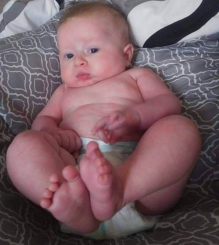 Huntley joined the competition — help win amazing prizes! arm, baby, cheek, child, diaper, eye, face, finger, hand, head, leg, lip, mouth, muscle, nose, person, sitting, skin, stomach, thumb