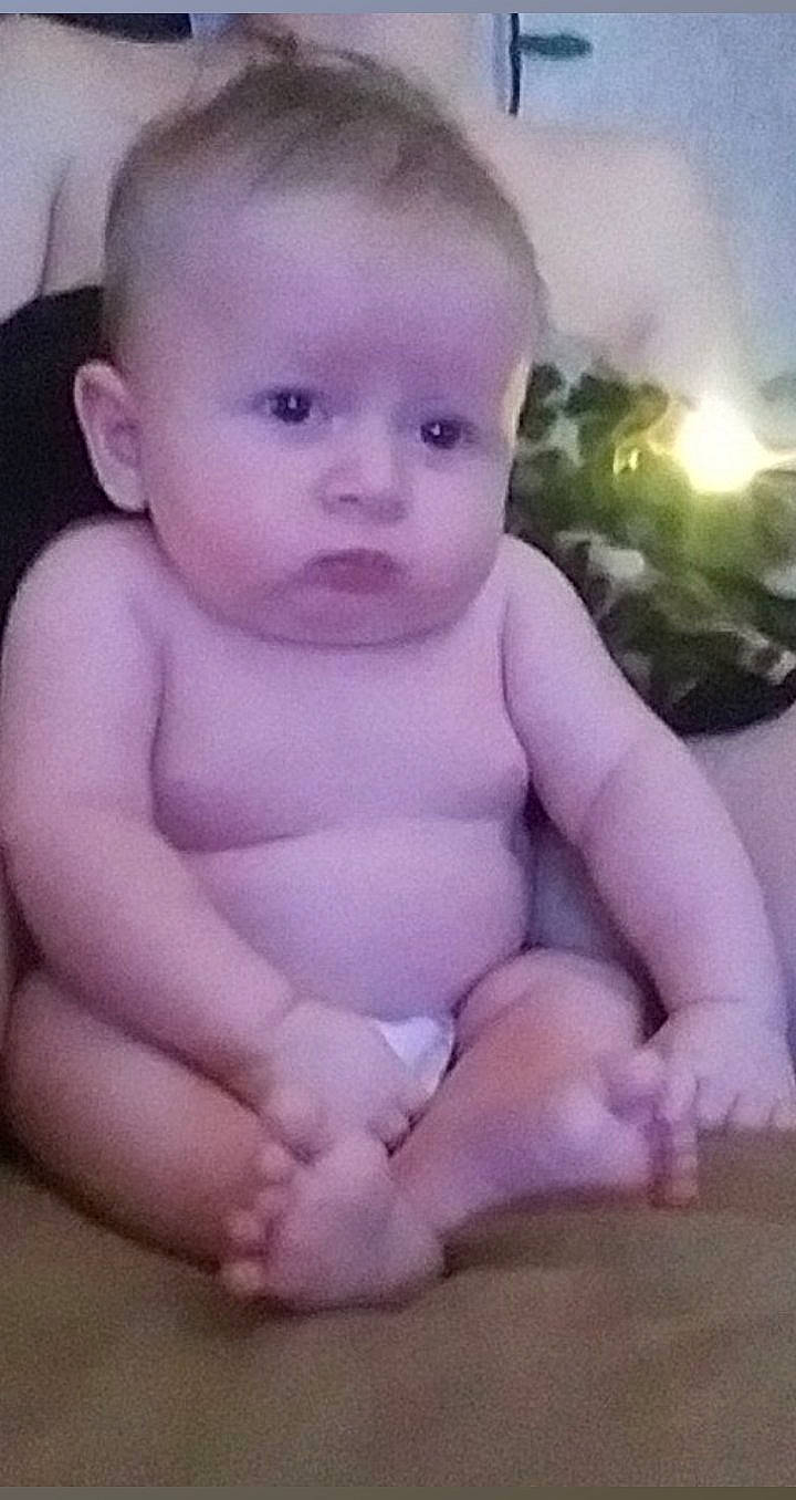 Huntley joined the competition — help win amazing prizes! baby, baby_making_funny_faces, cheek, child, chin, eye, face, facial_expression, forehead, head, human, leg, lip, mouth, nose, person, pink, sitting, skin, smile