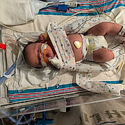 Wyatt joined the competition — help win amazing prizes! newborn, baby, infant, hospital, incubator, neonatal_care, medical_equipment, pacifier, diaper, blanket, heart, sleeping, face, legs, feet, tubes, wires, monitor, bedsheet, portrait