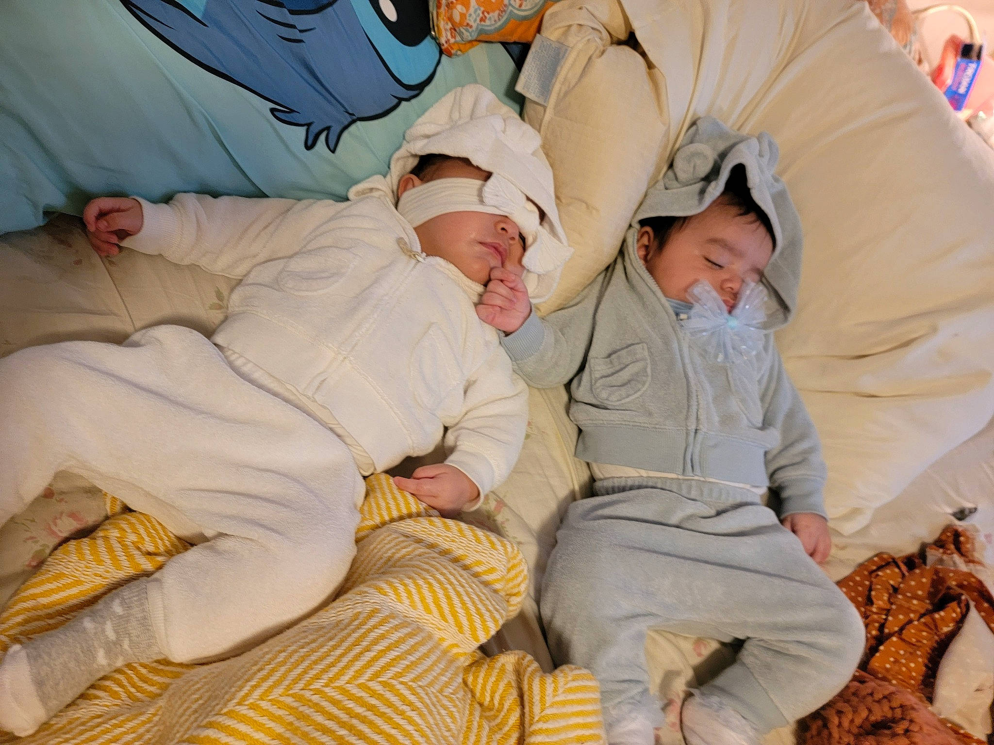 Leilani joined the competition — help win amazing prizes! baby, child, comfort, fun, gesture, glasses, happy, hat, human_leg, knee, leg, leisure, linens, nap, pattern, person, room, sitting, sleep, thigh