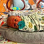 newborn, baby, pacifier, blanket, hospital, medical_tubes, towel, bed, infant, cute, animal_pattern, wrapped, lying_down, face, eyes_open, indoors, healthcare, care, person, portrait